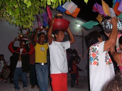Locals dancing with pigs' heads...