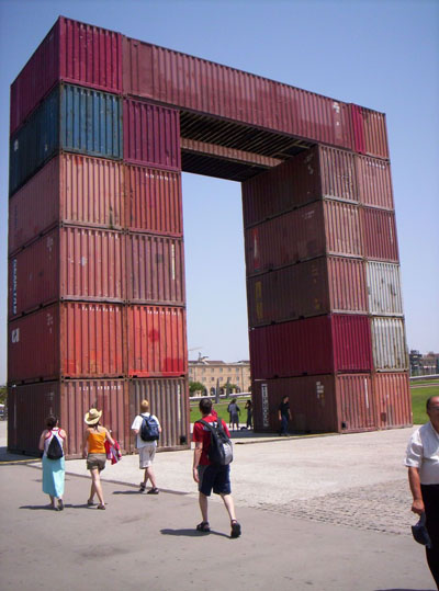 An 'Arc de Triomphe' looking structure at a waterfront park in Barcelona, but made out of shipping containers. 