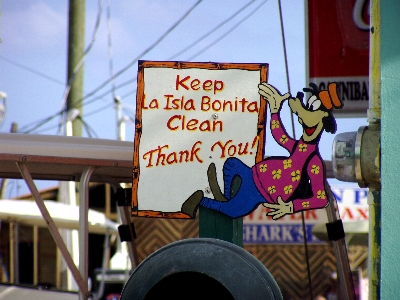 One of San Pedro's colorful anti-littering signs that cover the whole island.