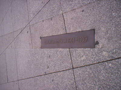 This plaque on the ground, along with a brick line, marks where the Berlin Wall stood for 38 years. 
