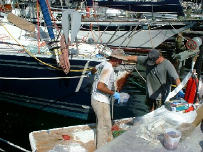 Repairs to Andiamo, starring Dave and Kevin, our neighbors at Dinner Key Marina (thanks guys for great work!)