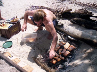 Jeffrey attending to the barbecue
